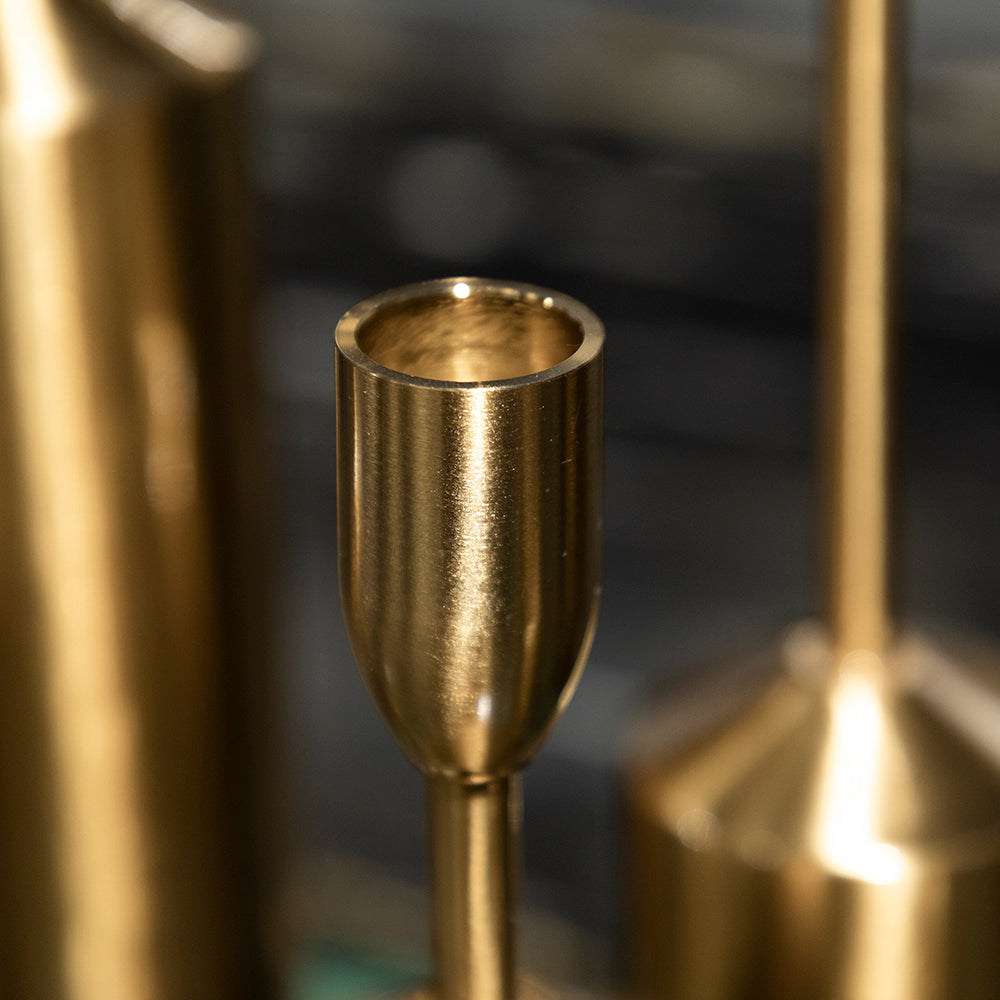 Gold candle holder with a blurred background